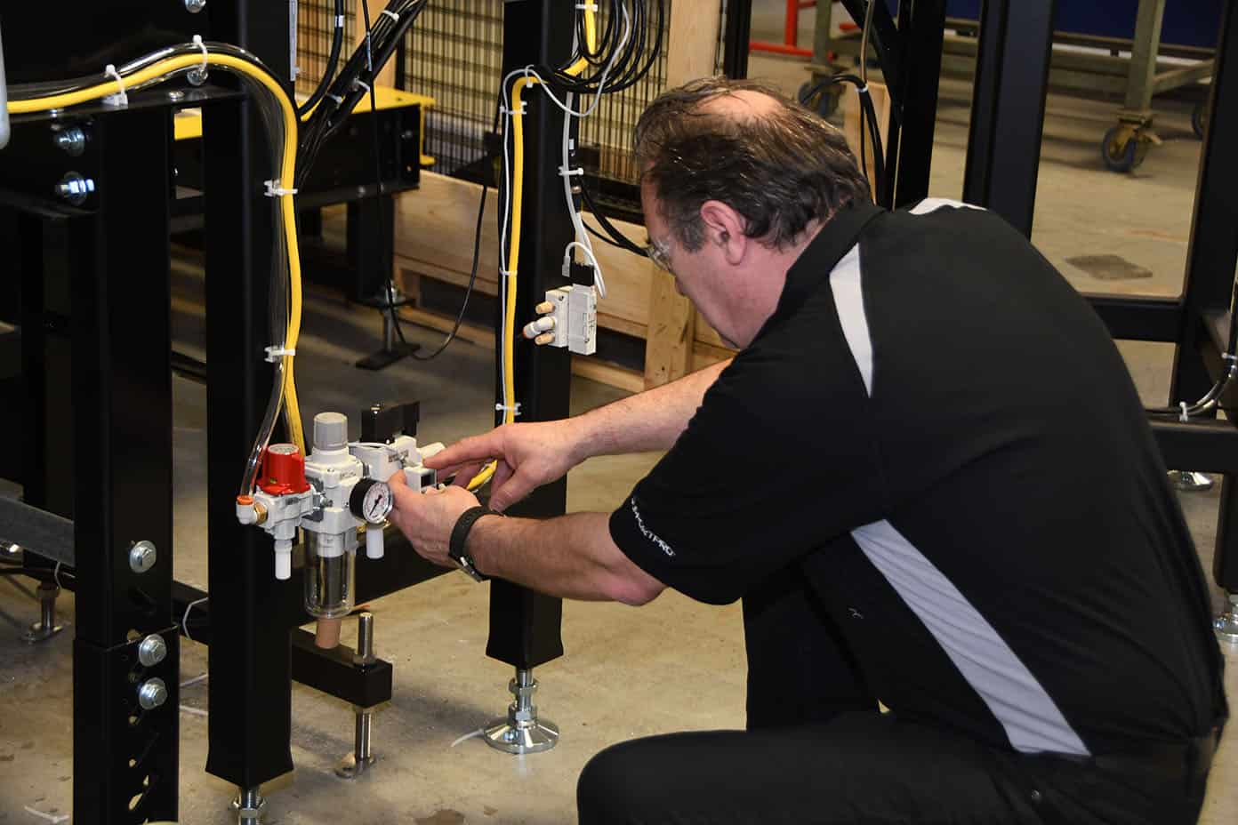 Worker checking an air line on equipment